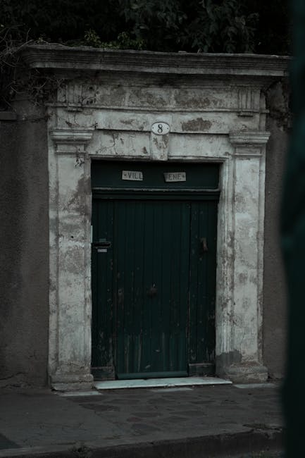 Old dark door with number 8